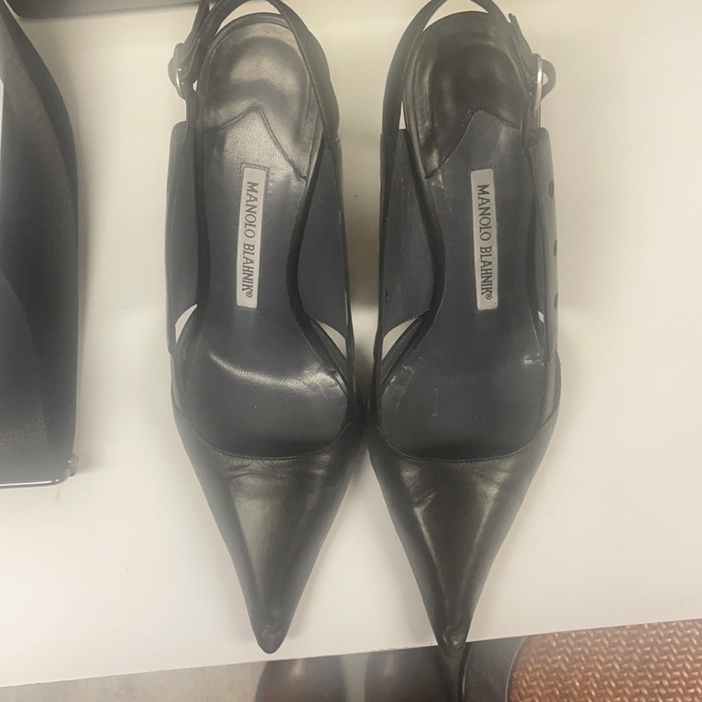 Black shoes pointed hot outside